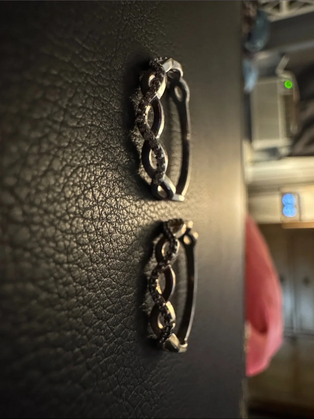 Size unknown: Silver and gold toned infinity rings- 2 rings